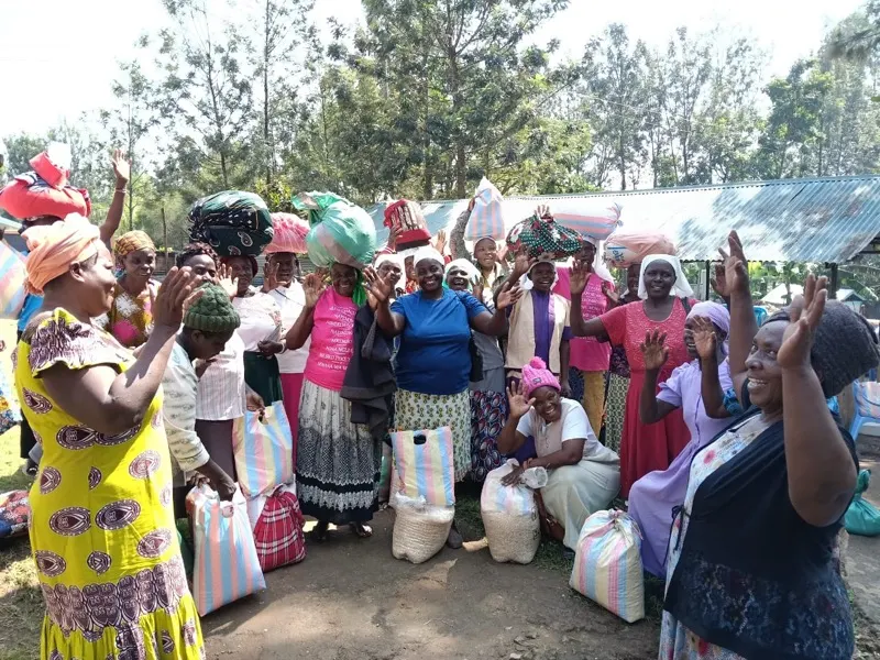 Widows in Waweza's program receiving supplies