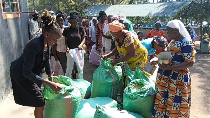 Widows sharing maize from the Waweza farm